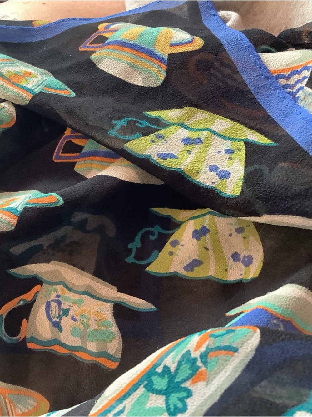 Two silk scarves..one made in Italy ( 20% silk) and one with colorful teapots
